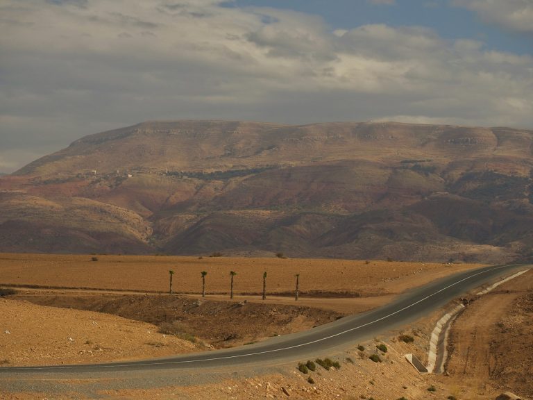 Empty road climbing through the Moroccan High Atlas, classic road-trip view